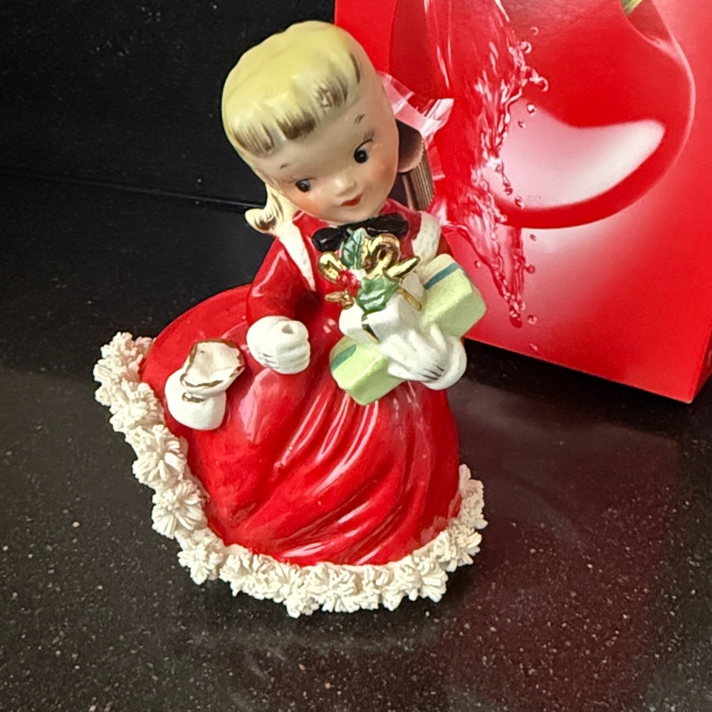 Napco Vintage 1956 Christmas Shopper girl 
( missing umbrella!)